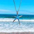 Pendentif étoile de mer en argent avec opale bleue