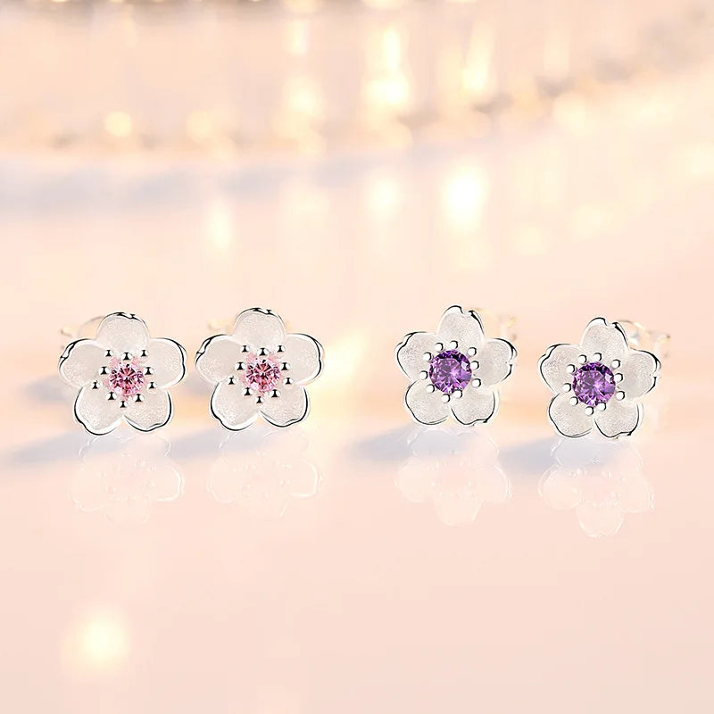 Boucles d'oreilles en forme de fleur avec des zirconiums