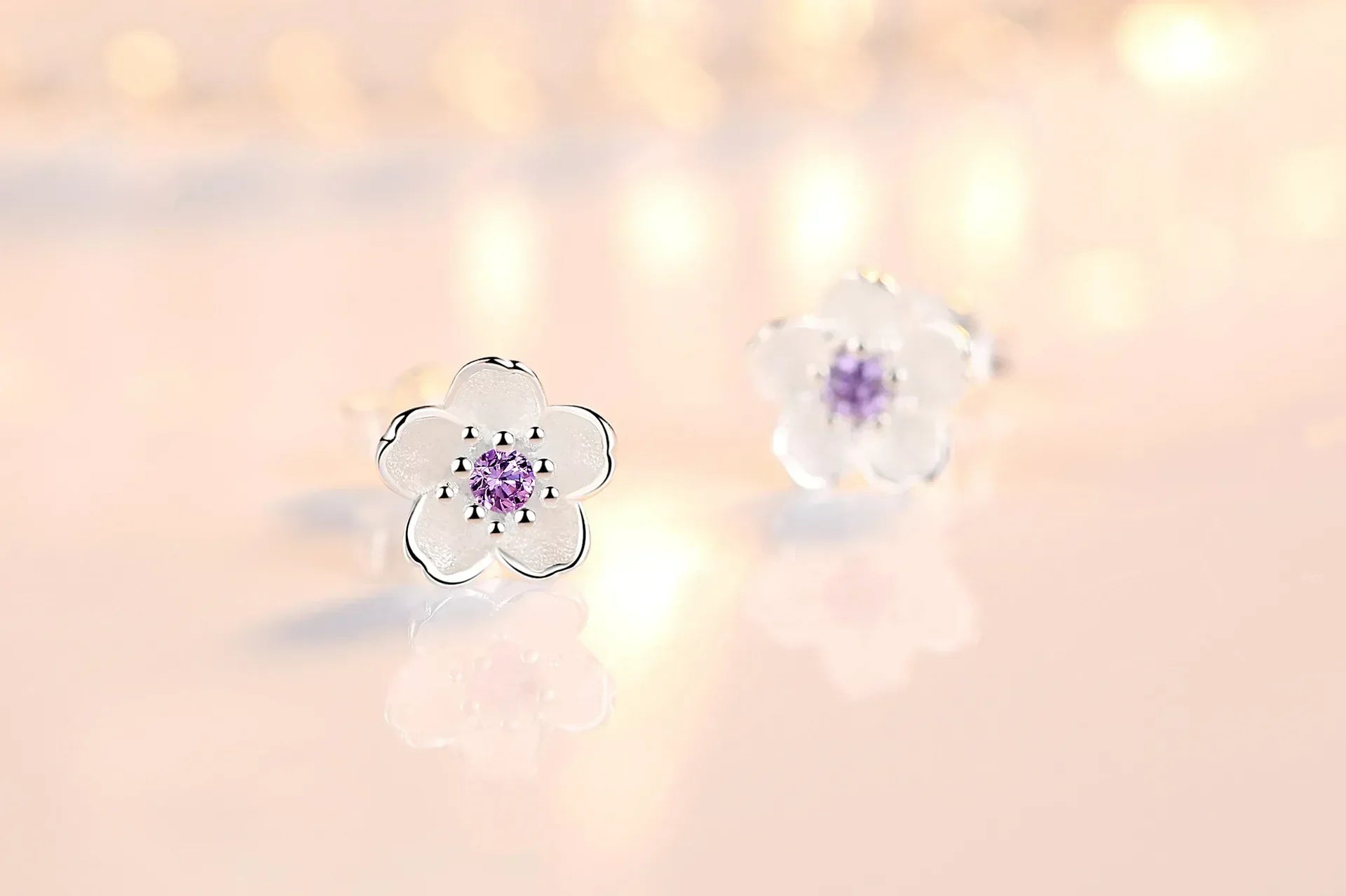 Boucles d'oreilles en forme de fleur avec des zirconiums